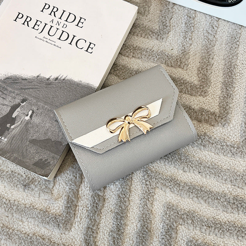 Portefeuille femme pliable triple, nœud chic