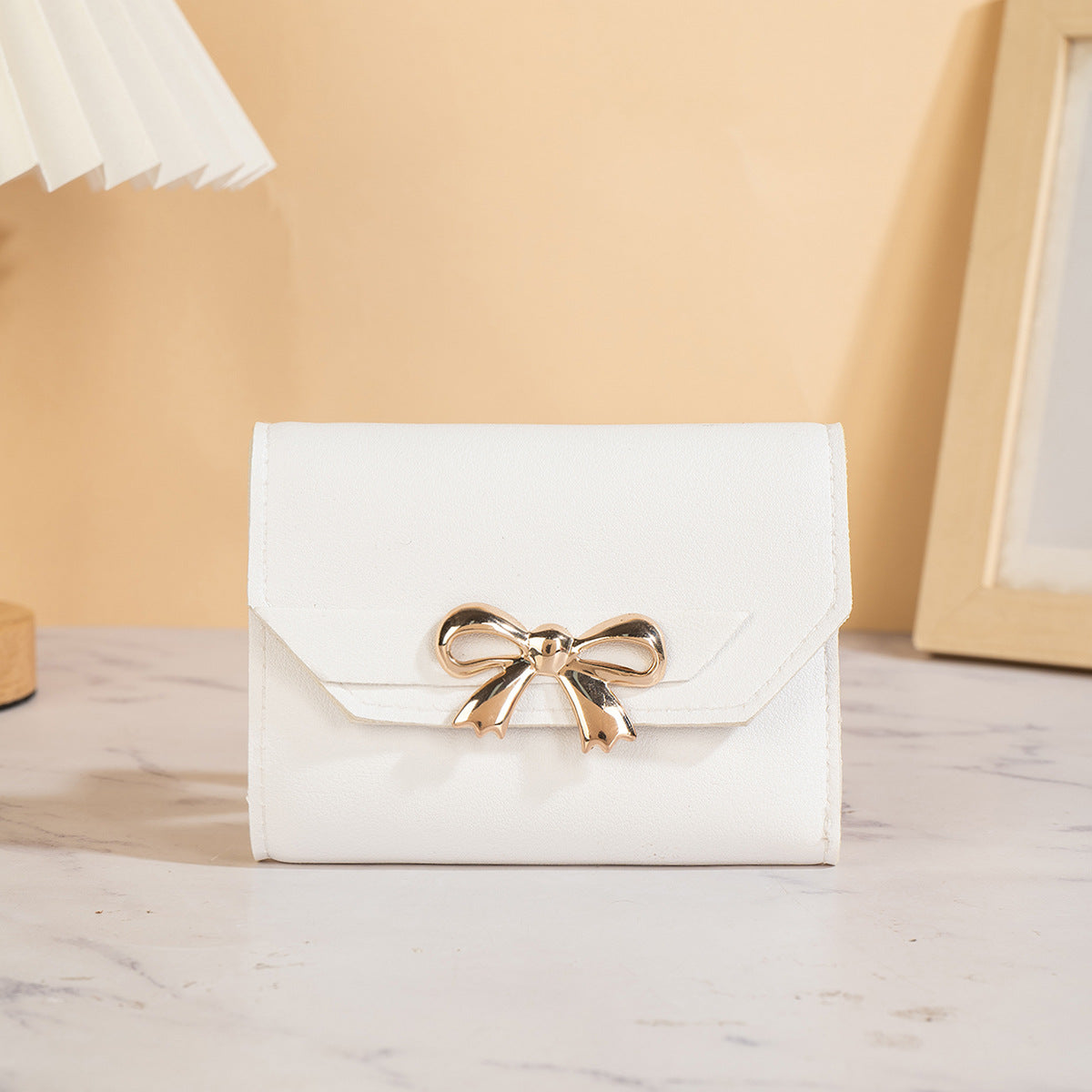 Portefeuille femme pliable triple, nœud chic